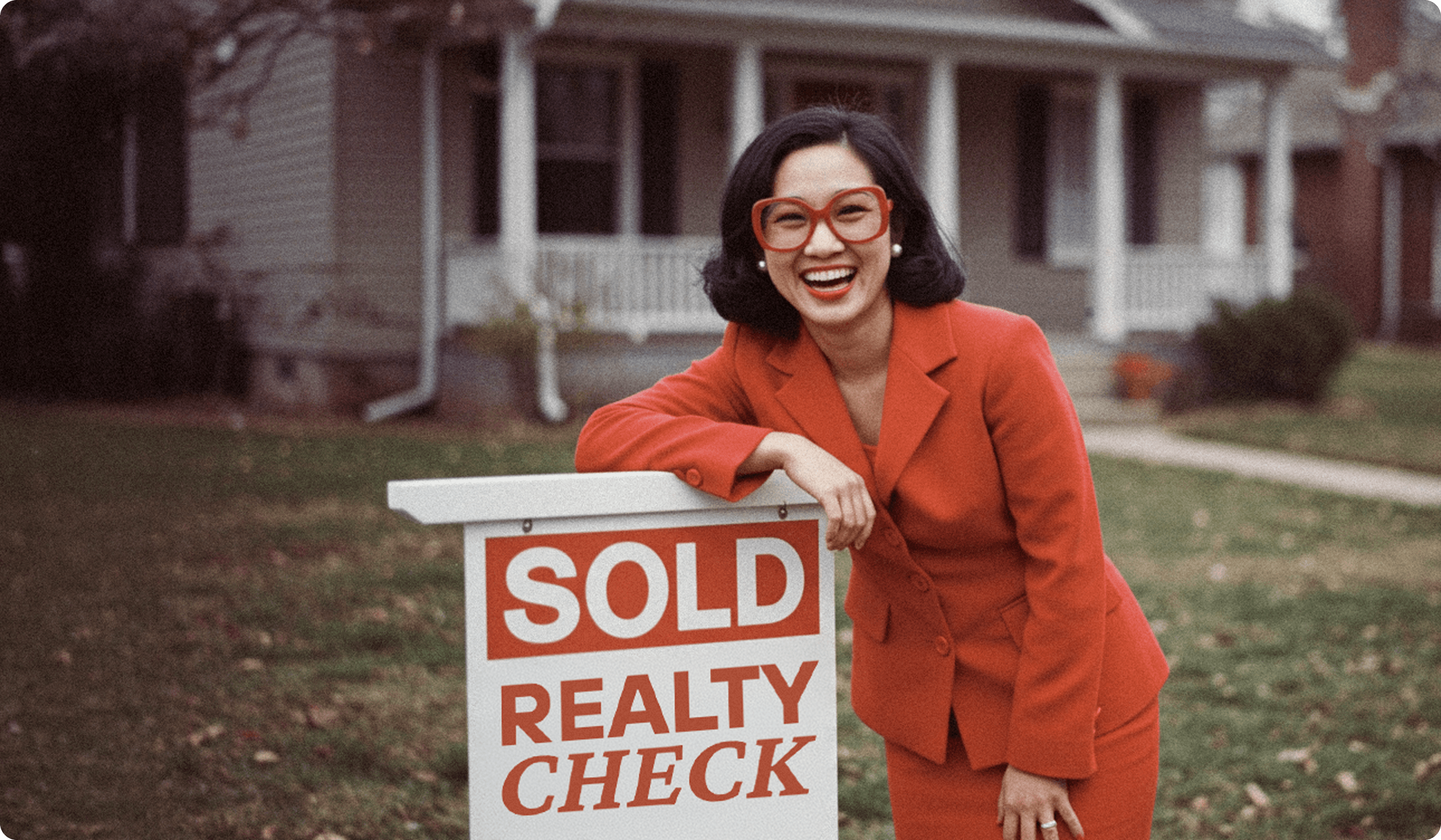 Women leaning on a sign